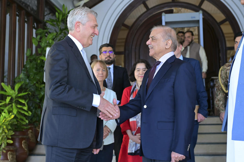 In this photo released by Pakistan's Prime Minister Office, the U.N. High Commissioner for Refugees, Filippo Grandi, left, shakes hand with Pakistan's Prime Minister Shehbaz Sharif after their meeting in Islamabad, Pakistan, Tuesday, July 9, 2024. The head of the U.N. refugee agency met with Sharif in the capital, Islamabad to discuss problems faced by the Afghan refugees, who have been living in the country in a state of uncertainty since last year when Islamabad started expelling foreigners, officials said. (Prime Minister Office via AP)