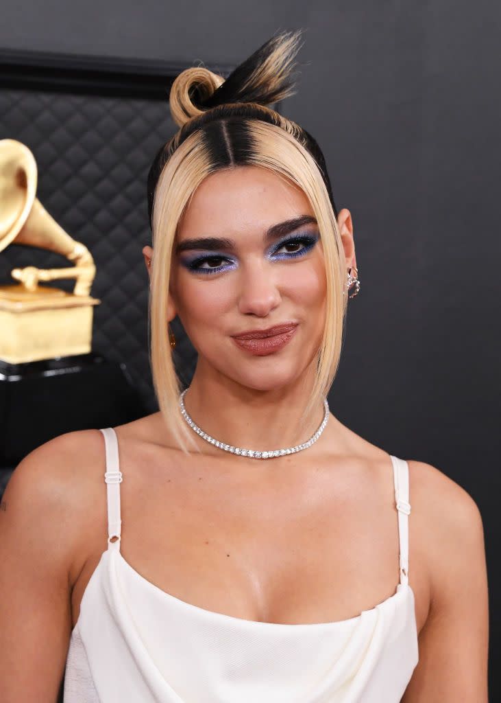 <p>Waiting a while for your next salon visit? You're not the only one — stars like <strong>Dua Lipa</strong> have embraced this casual, low-maintenance trend. Since giving your strands a rest between <a href="https://www.goodhousekeeping.com/beauty/hair/a32935610/how-to-bleach-hair/" rel="nofollow noopener" target="_blank" data-ylk="slk:bleaching sessions;elm:context_link;itc:0;sec:content-canvas" class="link ">bleaching sessions</a> is always a good idea, it's a trend that happens to be gentle on your hair, too.</p>