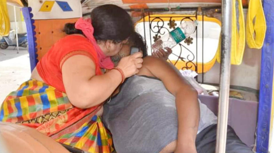 Renu Singhal seen with her husband, Ravi Singhal on the cart she used to transport him.