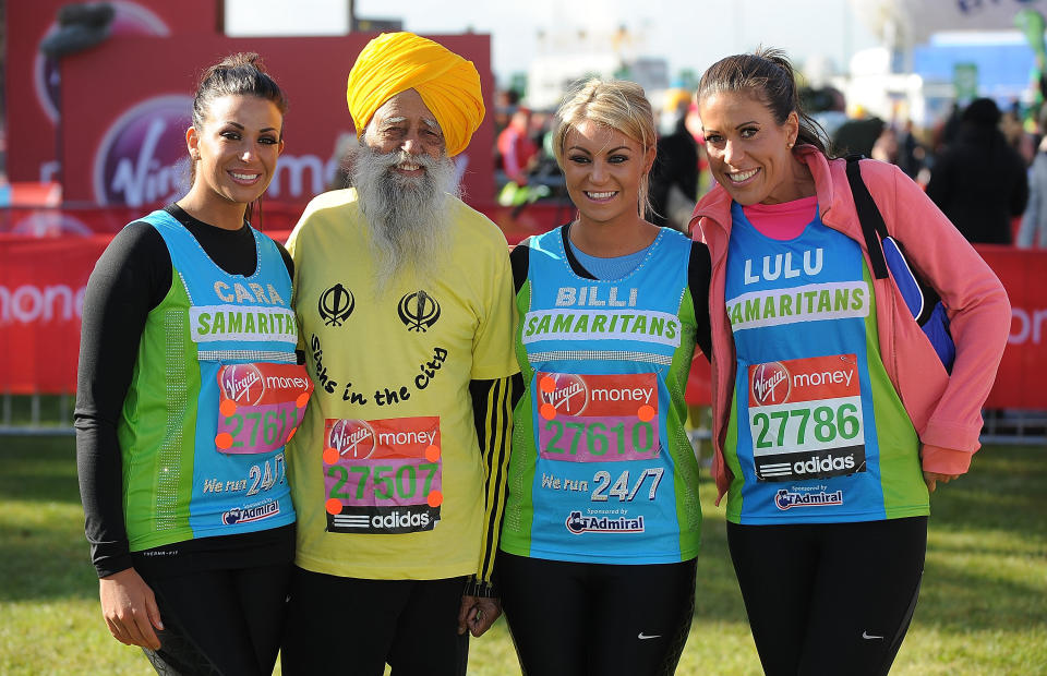 LONDON, ENGLAND - APRIL 22: Cara Kilbey, Fauja Singh, Billi Mucklow and their friend Lulu pose for the camera during the Virgin London Marathon 2012 on April 22, 2012 in London, England. (Photo by Christopher Lee/Getty Images)