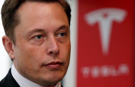 FILE PHOTO: Tesla Motors Inc Chief Executive Elon Musk pauses during a news conference in Tokyo September 8, 2014. REUTERS/Toru Hanai/File Photo