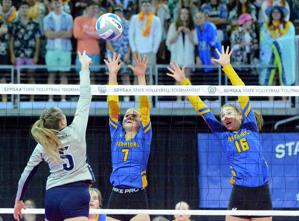 Castlewood's Cassidy Kirwan (7) and Presley Knecht go up for the block against Burke's Adisyn Indahl during their first-round Class B match in the state high school volleyball tournament on Thursday, Nov. 17, 2022 in the Denny Sanford PREMIER Center.