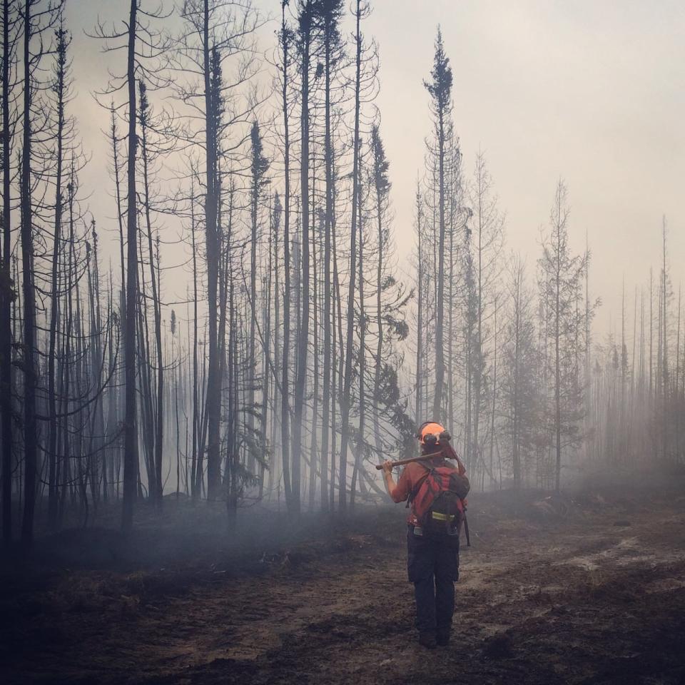 Alex Lane is pictured fighting a wildfire near Hudson's Hope, B.C., in 2016. (Submitted by Alex Lane - image credit)