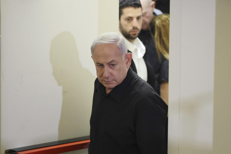 Israeli Prime Minister Benjamin Netanyahu attends a press conference with Defense Minister Yoav Gallant and Cabinet Minister Benny Gantz in the Kirya military base in Tel Aviv, Israel, Saturday, Oct. 28, 2023. (Abir Sultan/Pool Photo via AP)