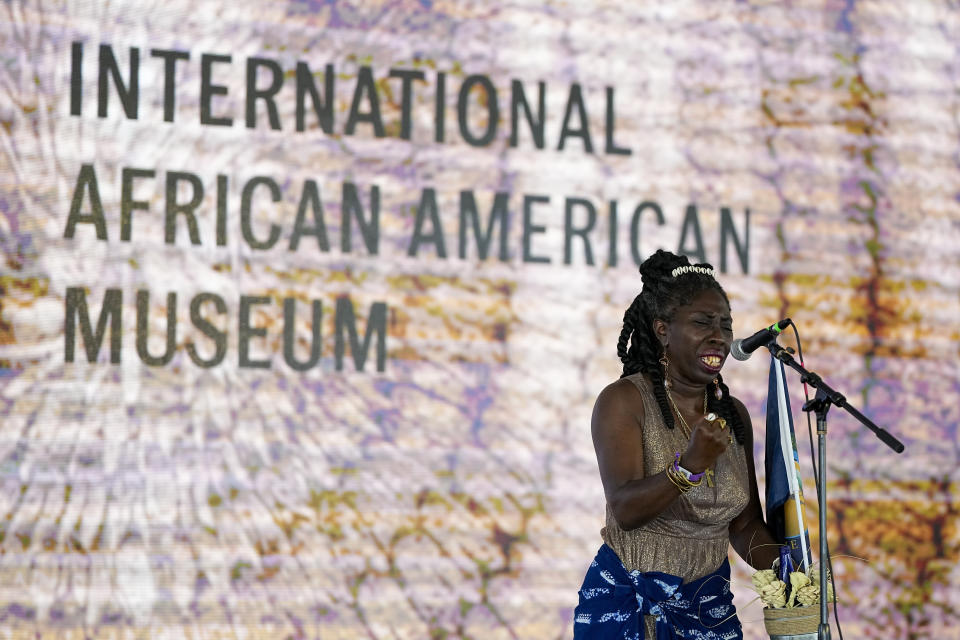 Queen Quet specks during the dedication ceremony for the International African American Museum on Saturday, June 24, 2023, in Charleston, S.C. Overlooking the old wharf at which nearly half of the enslaved population first entered North America, the 150,000-square foot museum houses exhibits and artifacts exploring how African Americans' labor, perseverance, resistance and cultures shaped the Carolinas, the nation and the world. (AP Photo/Chris Carlson)