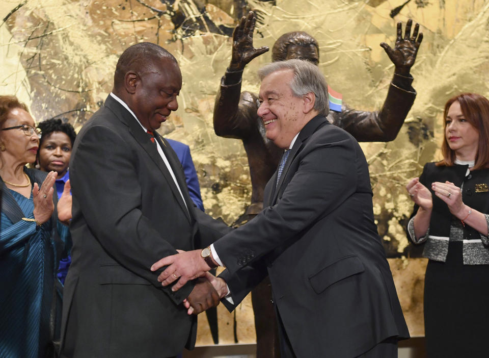 South Africa President Cyril Ramaphosa, left, and United Nations Secretary General Antonio Guterres shake hands after the unveiling ceremony of the Nelson Mandela Statue which was presented as a gift from South Africa, Monday, Sept. 24, 2018, at United Nations headquarters. (Angela Weiss/Pool Photo via AP)