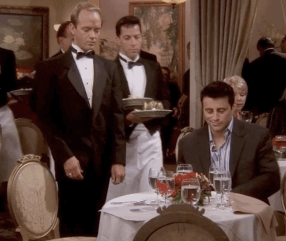 Joey eating in a nice restaurant in "Friends"