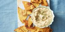 <p>This savory, flavorful dip is a guaranteed crowd-pleaser. Buy extra <em>chips! </em></p><p>Get the <a href="https://www.goodhousekeeping.com/food-recipes/a38842/grilled-onion-dip-recipe/" rel="nofollow noopener" target="_blank" data-ylk="slk:Grilled Onion Dip recipe;elm:context_link;itc:0;sec:content-canvas" class="link "><strong>Grilled Onion Dip recipe</strong></a>.</p>