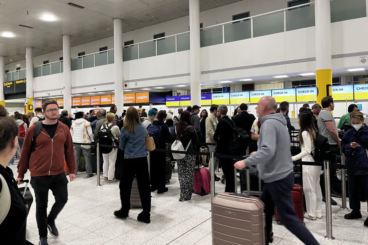 Passengers at Gatwick Airport  (PA Archive)