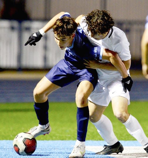 Players from Bartlesville, left, and Bishop Kelley scrap for ball control during high school boys soccer action on March 3, 2023, at Bartlesville.
