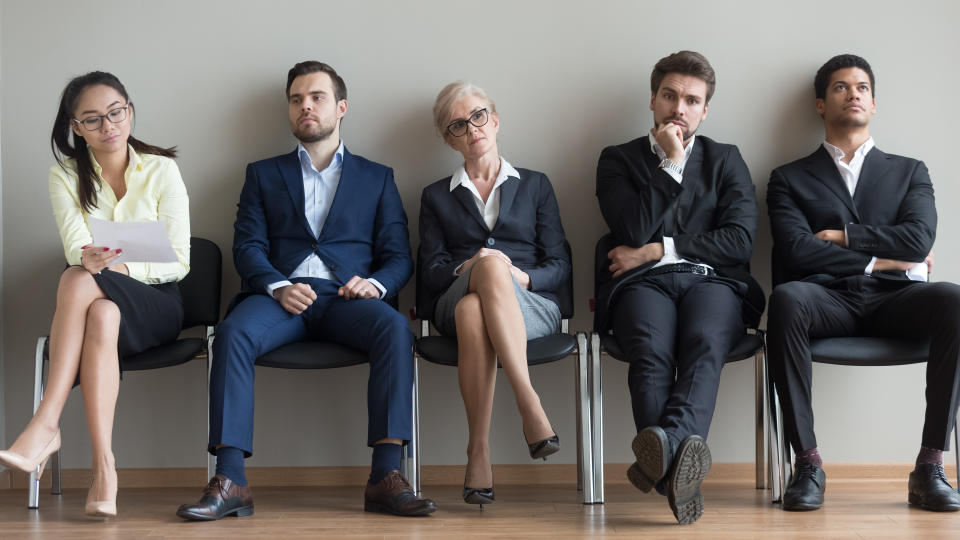 Diverse business people applicants waiting for their turn preparing for job interview sit in line queue, horizontal wide photo banner for website header design, human resources, job search concept