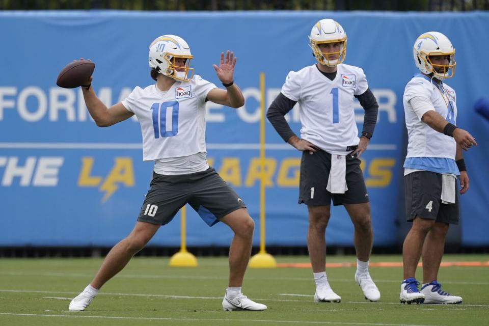 Los Angeles Chargers quarterback Justin Herbert (10) participates in drills