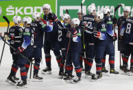 United States players celebrate their 6-1 victory during the Ice Hockey World Championship quarterfinal match between the United States and Slovakia at the Arena in Riga, Latvia, Thursday, June 3, 2021.(AP Photo/Sergei Grits)