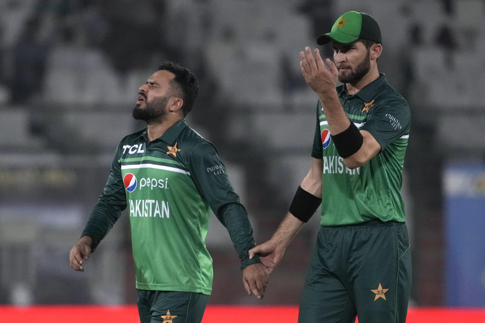 Pakistan's Shaheen Shah Afridi, right, escorts Mohammad Nawaz who reacts after a ball hit on his finger during the third one-day international cricket match between Pakistan and New Zealand, in Karachi, Pakistan, Wednesday, May 3, 2023. (AP Photo/Fareed Khan)