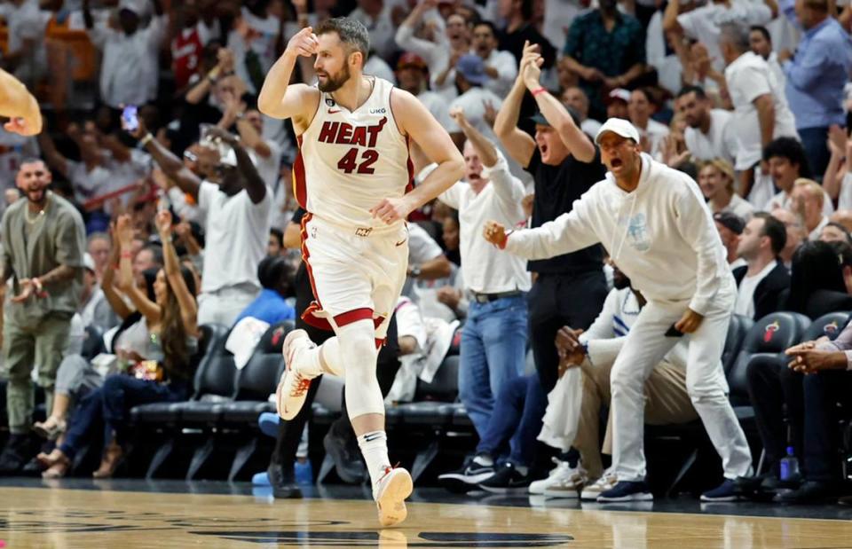 Miami Heat forward Kevin Love (42) reacts after sinking a three-pointer against the Denver Nuggets during the first half of Game 3 of the NBA Finals at the Kaseya Center in Miami on Wednesday, June 7, 2023.