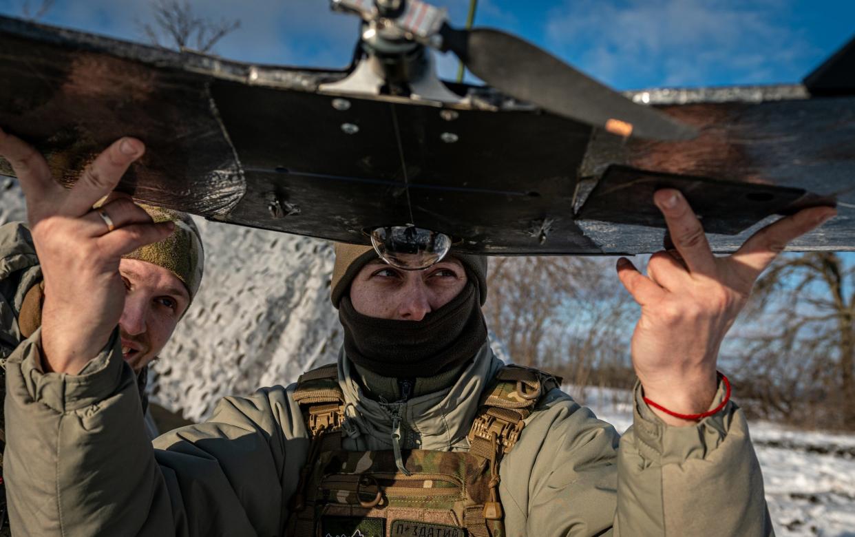 A Ukrainian soldier preparing a long-range drone for take-off near Bakhmut, Donetsk