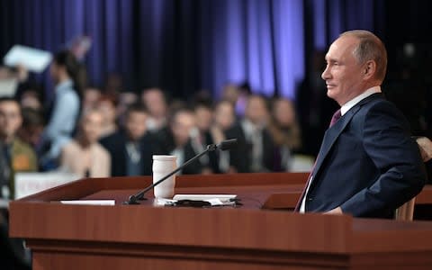 Russian President Vladimir Putin speaks during his annual press conference in Moscow - Credit:  AFP