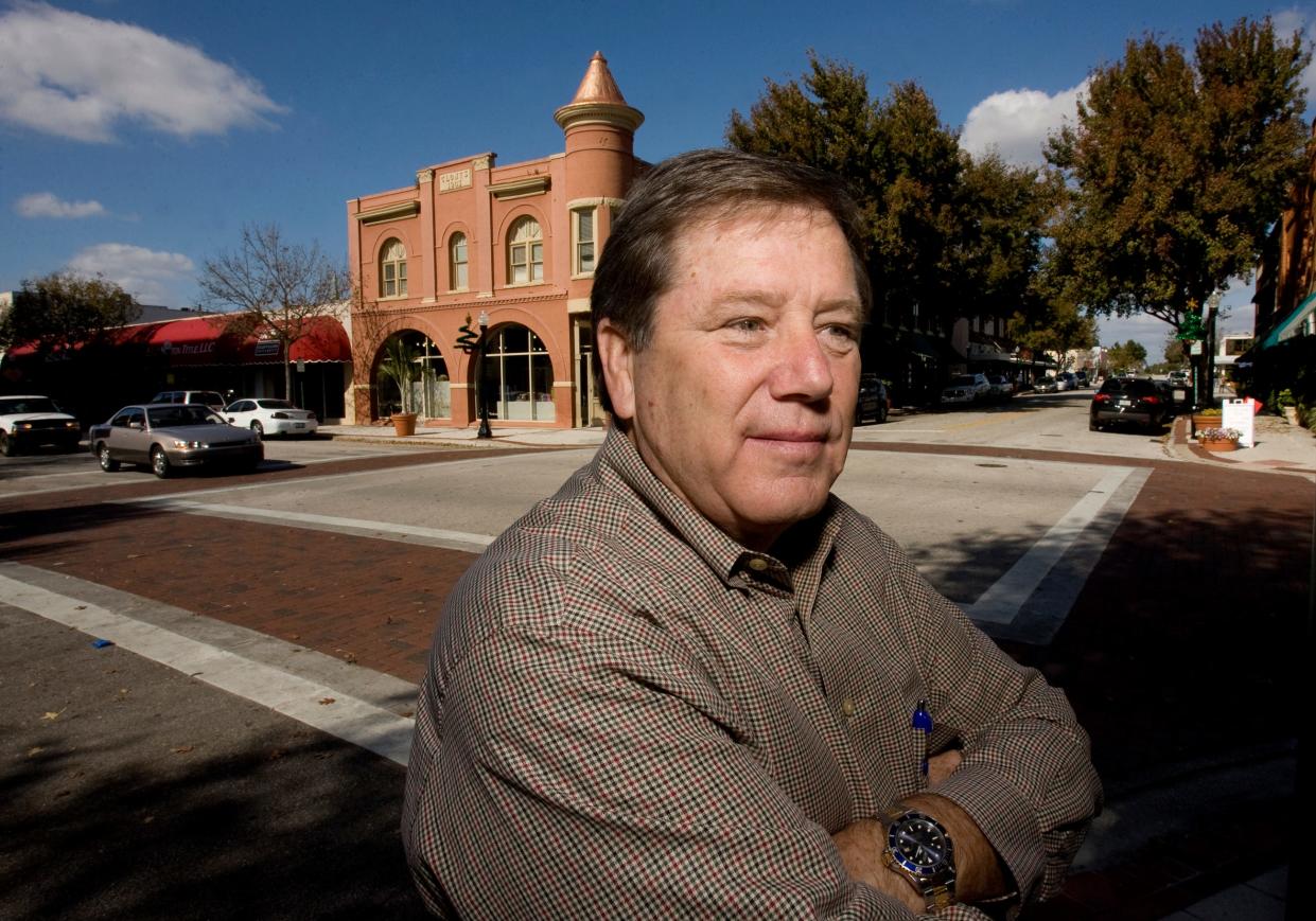 Jerry Herring stands before the historic Clonts Building in downtown Lakeland in 2008. Herring, a force in the redevelopment of the city's downtown, died recently at age 76.