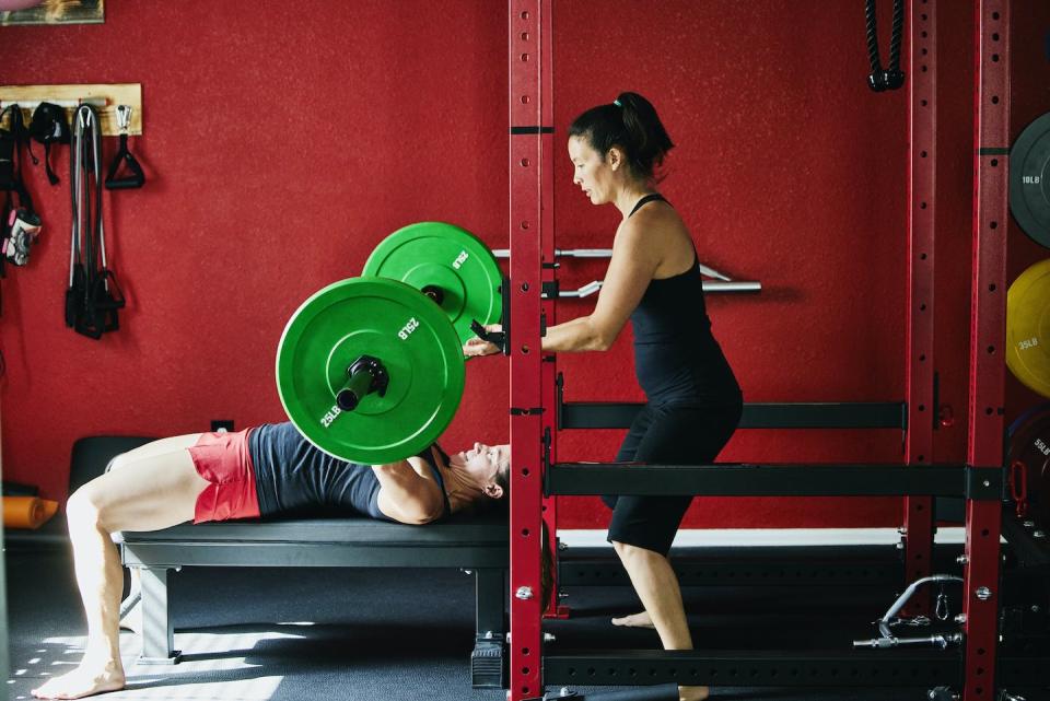 Lifting weights and doing pushups and other strength training exercises cause muscles to grow in size and strength. <a href="https://www.gettyimages.com/detail/photo/wide-shot-of-woman-spotting-friend-bench-pressing-royalty-free-image/1346267080?adppopup=true" rel="nofollow noopener" target="_blank" data-ylk="slk:Thomas Barwick/Digital Vision via Getty Images;elm:context_link;itc:0;sec:content-canvas" class="link ">Thomas Barwick/Digital Vision via Getty Images</a>