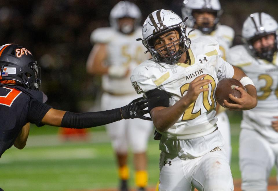 Austin's Kevin Rodela runs down the field avoiding an El Paso defender during the 93 annual "Battle of the Claw" at El Paso High School on Sept. 22, 2023.