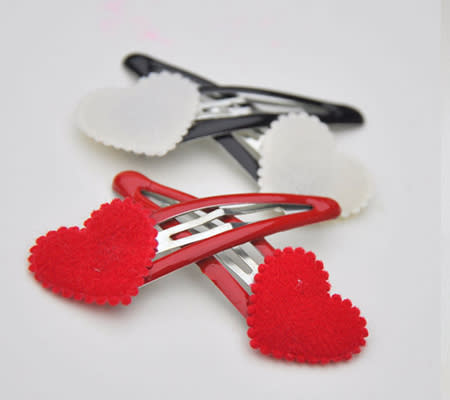 <div class="caption-credit"> Photo by: Heather's Treasure</div><b>Festive Heart Hair Clips <br></b> For little ladies with lustrous locks, why not add some Valentine's Day fun with these soft and pretty heart hair clips? <br> <i><a href="http://www.disneybaby.com/blog/wear-your-heart-on-your-sleeve-20-adorable-handmade-heart-accessories/#slide10" rel="nofollow noopener" target="_blank" data-ylk="slk:Get it here;elm:context_link;itc:0;sec:content-canvas" class="link ">Get it here</a></i> <br>