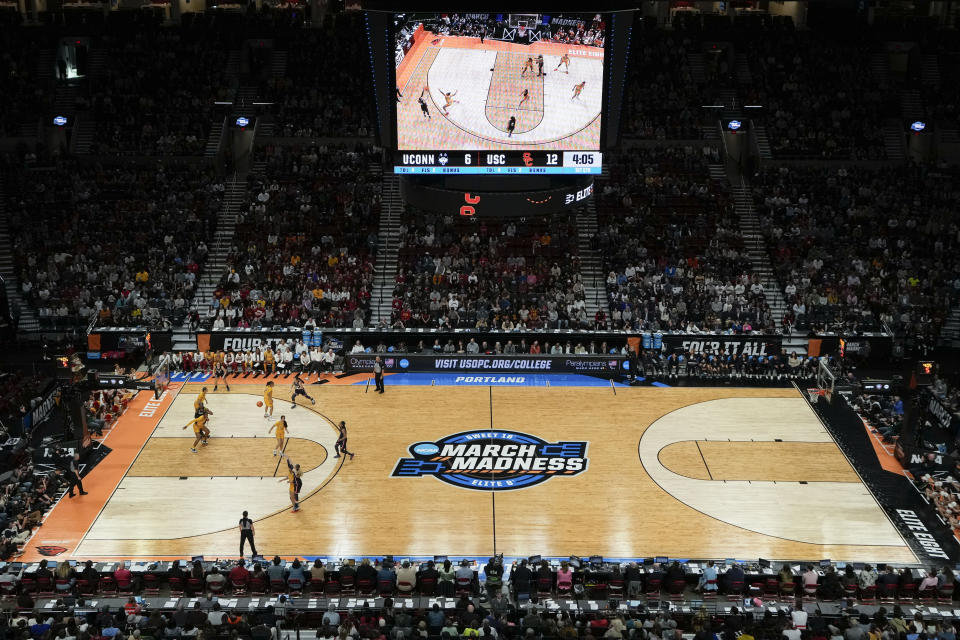 UConn guard Paige Bueckers (5) shoots a 3-point shot during the first half of an Elite Eight college basketball game against Southern California in the women's NCAA Tournament, Monday, April 1, 2024, in Portland, Ore. (AP Photo/Jenny Kane)