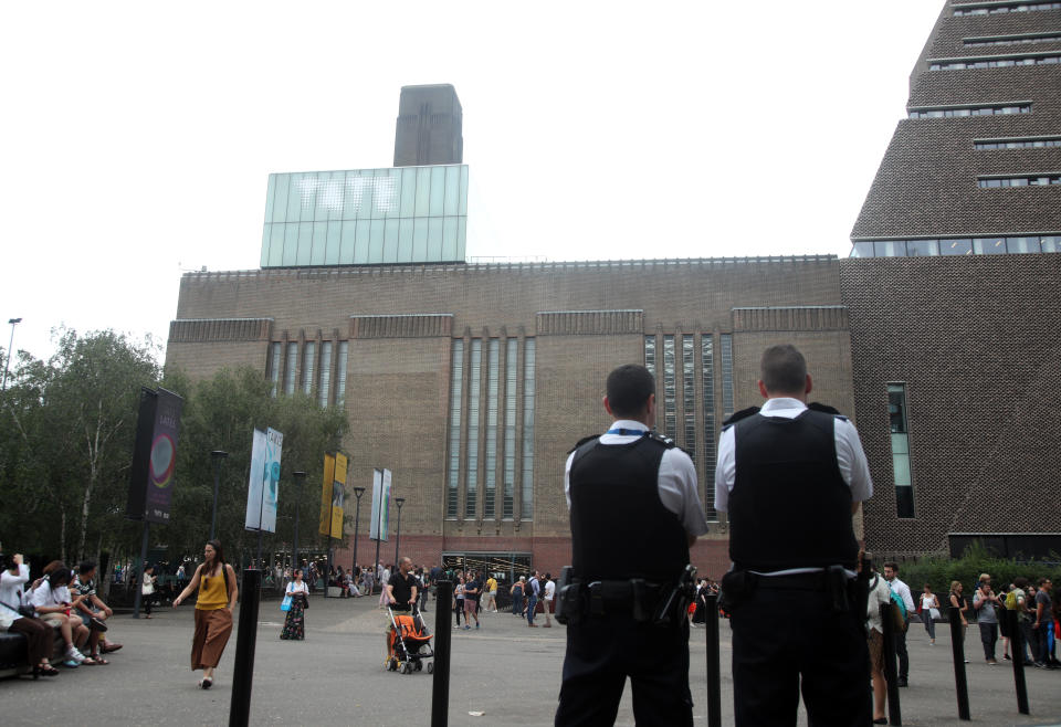 Emergency crews attending a scene at the Tate Modern art gallery, where a teenager has been arrested after a child fell from height and has been taken to hospital from the gallery in central London by air ambulance.