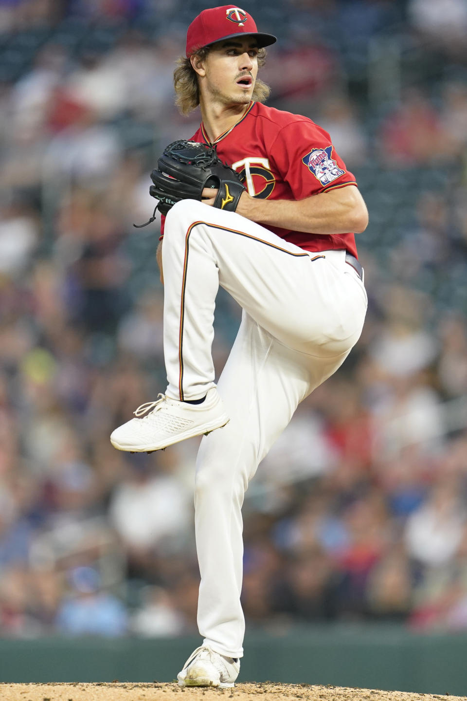 Minnesota Twins starting pitcher Joe Ryan winds up to deliver during the third inning of a baseball game against the San Francisco Giants, Friday, Aug. 26, 2022, in Minneapolis. (AP Photo/Abbie Parr)