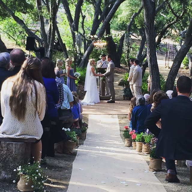 <em>Glee</em> star Heather Morris and her high school sweetheart Taylor Hubbell tied the knot on Saturday in a gorgeous ceremony in Topanga, Calif. In attendance were family, friends, and many of Morris’ <em>Glee</em> castmates! The whole beautiful affair, which was held outdoors at Old Canyon Ranch near Los Angeles, ended up serving as a mini <em>Glee </em>reunion of sorts. Kevin McHale, Jenna Ushkowitz and Vanessa Lengies were on hand to share in the joy. <strong>VIDEO: Celebrity Summer Wedding Watch: Who's Getting Hitched? </strong> Also in attendance was Morris’ on-screen spouse, Naya Rivera. On the Fox musical dramedy Morris played Brittany Pierce, who wed Rivera’s Santana Lopez during the show’s sixth season. Morris looked absolutely stunning in a long, flowing white wedding gown, while Hubbell’s tan, earthy suit was the perfect complement to the outdoor proceedings. The couple said their vows in front of their 1-year-old son Elijah, whom the couple welcomed in September 2013. <strong>VIDEO: The 6 Biggest Celebrity Weddings of 2014! </strong> Lengies, who played Sugar Motta on <em> Glee</em>, snapped a number of great pics, and posted a huge group photo booth shot to Instagram showing Morris and all her friends celebrating the big day. While <em>Glee</em> might have aired its last episode on March 20, it’s clear that the friendships made on set are far from over. Congrats to the happy couple! For more celebrity summer weddings to get excited about, check out the video below.