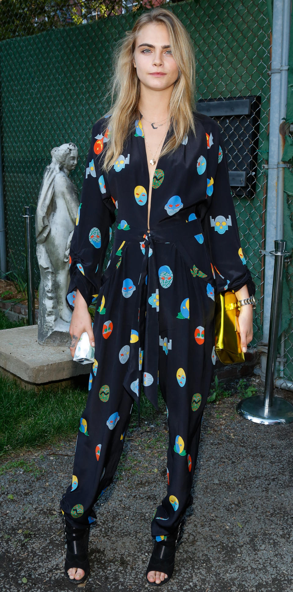 <p>The model-cum-actress stepped out in a colorful PJ-inspired jumpsuit from Stella McCartney's 2015 Resort collection (shop a similar style from the designer <a rel="nofollow noopener" href="https://www.net-a-porter.com/us/en/product/803268?" target="_blank" data-ylk="slk:here;elm:context_link;itc:0;sec:content-canvas" class="link ">here</a>). </p>