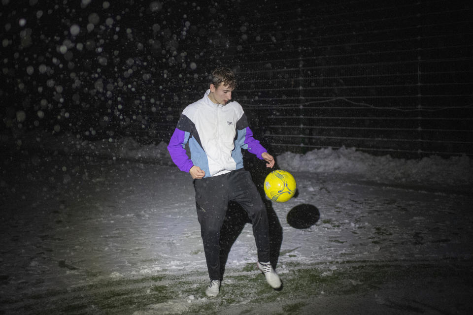 tudent Ivan Mahyrovskyi, 16, controls the ball in a soccer game during a blackout in Irpin, Kyiv region, Ukraine, Tuesday, Nov. 29, 2022. For soccer lovers in Ukraine, Russia's invasion and the devastation it has wrought have created uncertainties about both playing the sport and watching it. For Ukrainians these days, soccer trails well behind mere survival in the order of priorities. (AP Photo/Andrew Kravchenko)