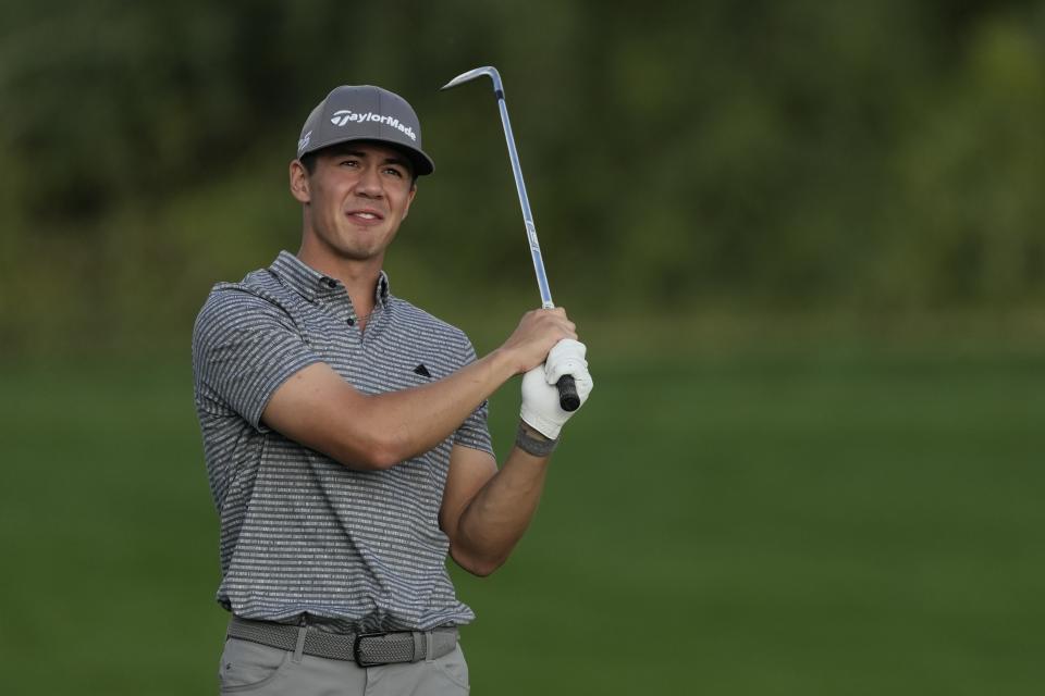 Michael Thorbjornsen of the U.S. plays his second shot on the 9th hole during the competition of the second round of the Dubai Desert Classic, in Dubai, United Arab Emirates, Saturday, Jan. 28, 2023. (AP Photo/Kamran Jebreili)