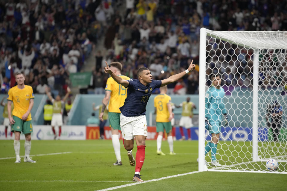 France's Kylian Mbappe celebrates after scoring against Australia during the World Cup group D soccer match between France and Australia, at the Al Janoub Stadium in Al Wakrah, Qatar, Tuesday, Nov. 22, 2022. (AP Photo/Christophe Ena)