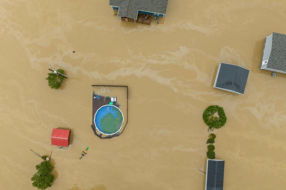 Aerial image of a flooded residential area in Quicksand, Kentucky, as homes are surrounded by intense floodwaters (AP)