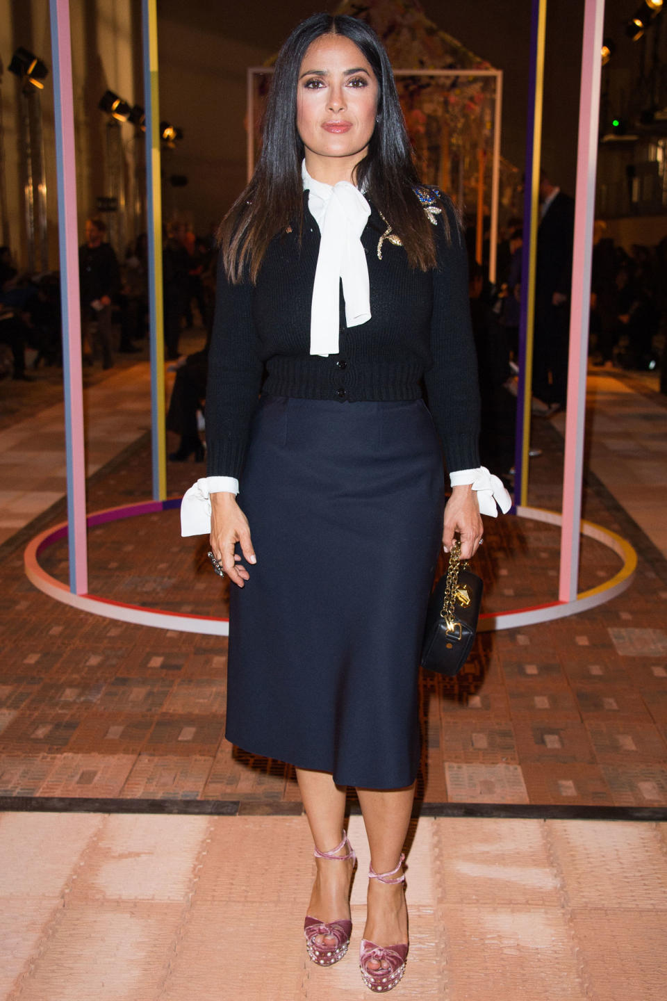 <p><strong>2 October</strong> Salma Hayek attended the Alexander McQueen show<span> wearing a smart pencil skirt with a blouse, jumper and pink velvet pearl-studded platforms. </span></p>