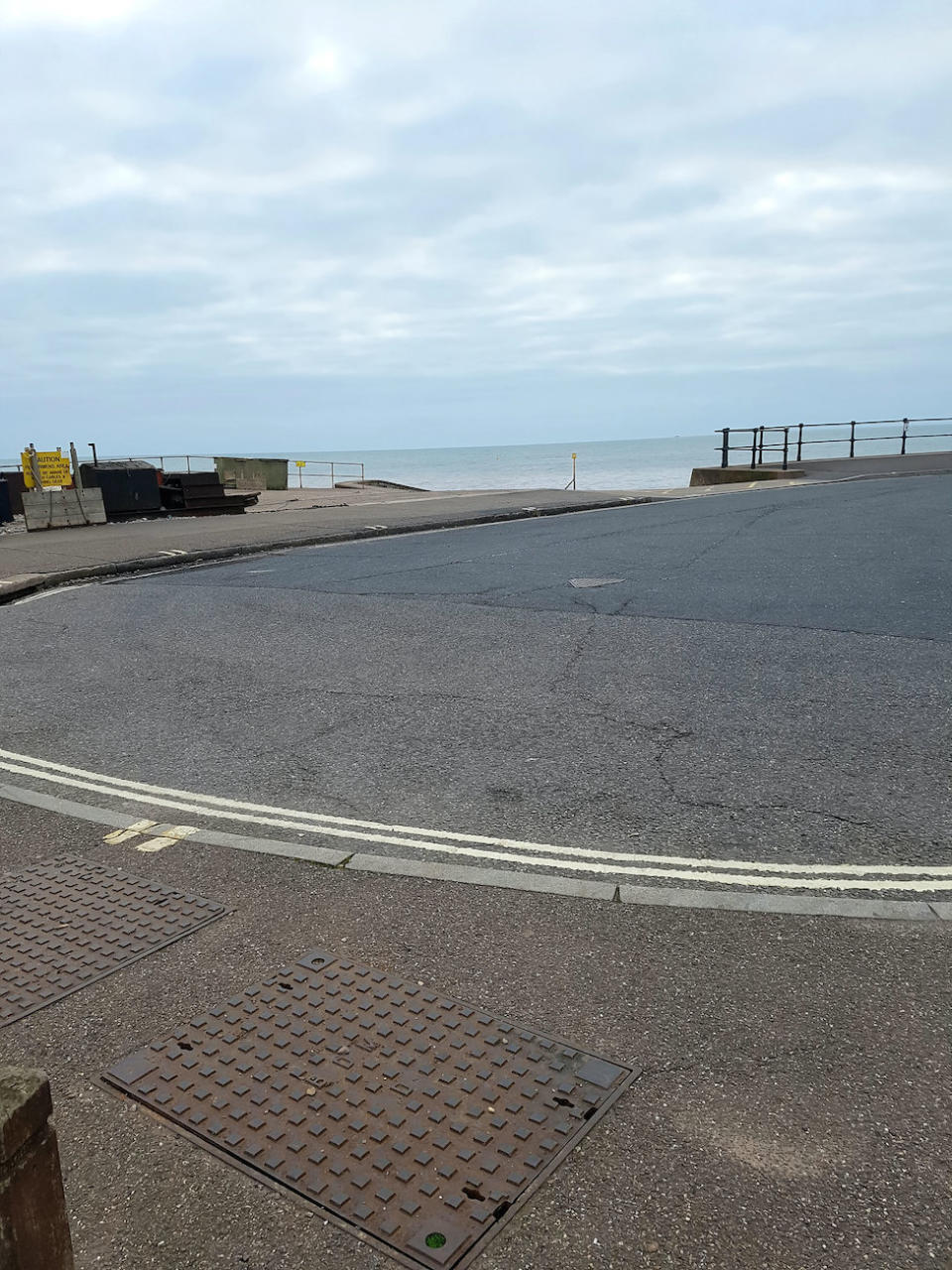 The mass is underneath this sewer grate in Sidmouth, Devon (Picture: SWNS)