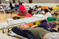 Fort McMurray residents rest at a community centre in Anzac, Alberta, after residents were ordered to be evacuated due to a raging wildfire, May 4, 2016. REUTERS/Topher Seguin