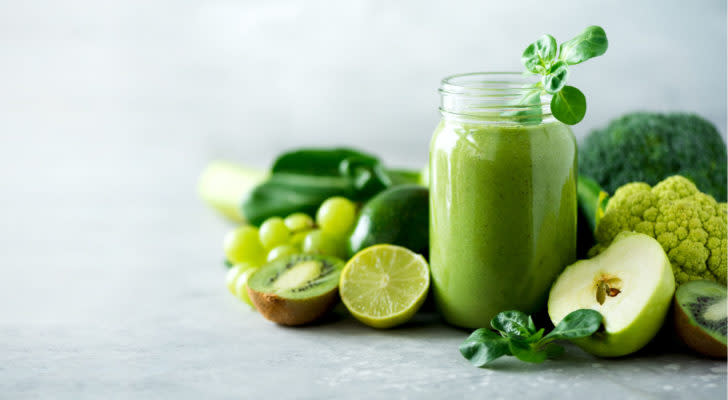 Green vegetables against blue background.