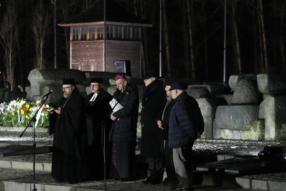 Clerics recite prayers by the monument at the Birkenau Nazi death camp during a ceremony in Oswiecim, Poland, Saturday, Jan. 27, 2024. Survivors of Nazi death camps marked the 79th anniversary of the liberation of the Auschwitz-Birkenau camp during World War II in a ceremony in southern Poland.(AP Photo/Czarek Sokolowski)