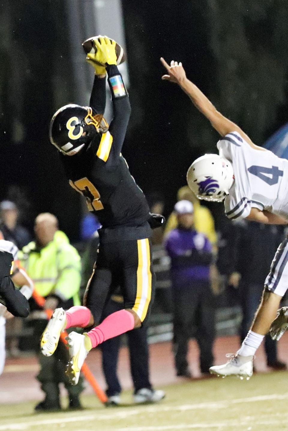 Enterprise's Jahari Johnson catches a 4-yard pass from quarterback Demarreya Lewis-Cooper for a touchdown in the first quarter against Shasta in the River Bowl on Friday, Oct. 22, 2021. Enterprise won 26-8.