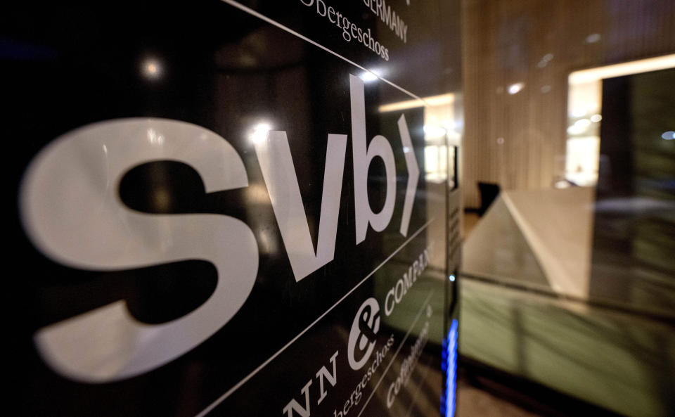 A sign of a branch of the Silicon Valley Bank is pictured at an office building where the bank is located in Frankfurt, Germany, Sunday, March 12, 2023. (AP Photo/Michael Probst)