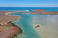 Aerial photo shows divers from Deep History of Sea Country searching for artefacts off Dampier Archipelago in Western Australia