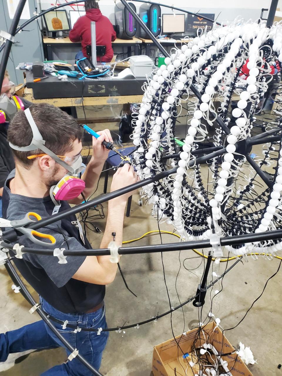 Working on the "ball" that will be dropped. It's 6 feet in diameter and at the center of the ball is the nucleus of the atom with more than 2,000 lights.