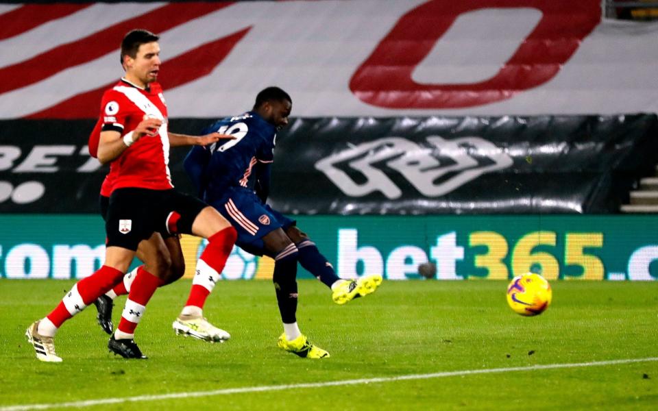 Arsenal's Nicolas Pepe scores their side's first goal of the game during the Premier League match at St Mary's Stadium - Frank Augstein/PA