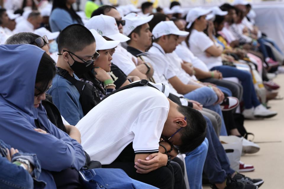 A man prays ahead of a Holy Mass that will be held by Pope Francis at Bahrain National Stadium in Manama, Bahrain, Saturday, Nov. 5, 2022. Pope Francis is making the Nov. 3-6 visit to participate in a government-sponsored conference on East-West dialogue and to minister to Bahrain's tiny Catholic community, part of his effort to pursue dialogue with the Muslim world. (AP Photo/Hussein Malla)