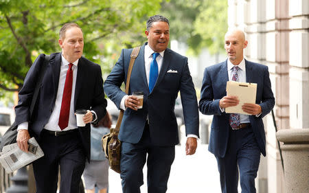 Jason Sullivan (C), a social media expert who worked for longtime Trump adviser Roger Stone, arrives at U.S. District Court to respond to a subpoena and testify before Special Counsel Robert Mueller's grand jury in Washington, U.S., June 1, 2018. REUTERS/Kevin Lamarque