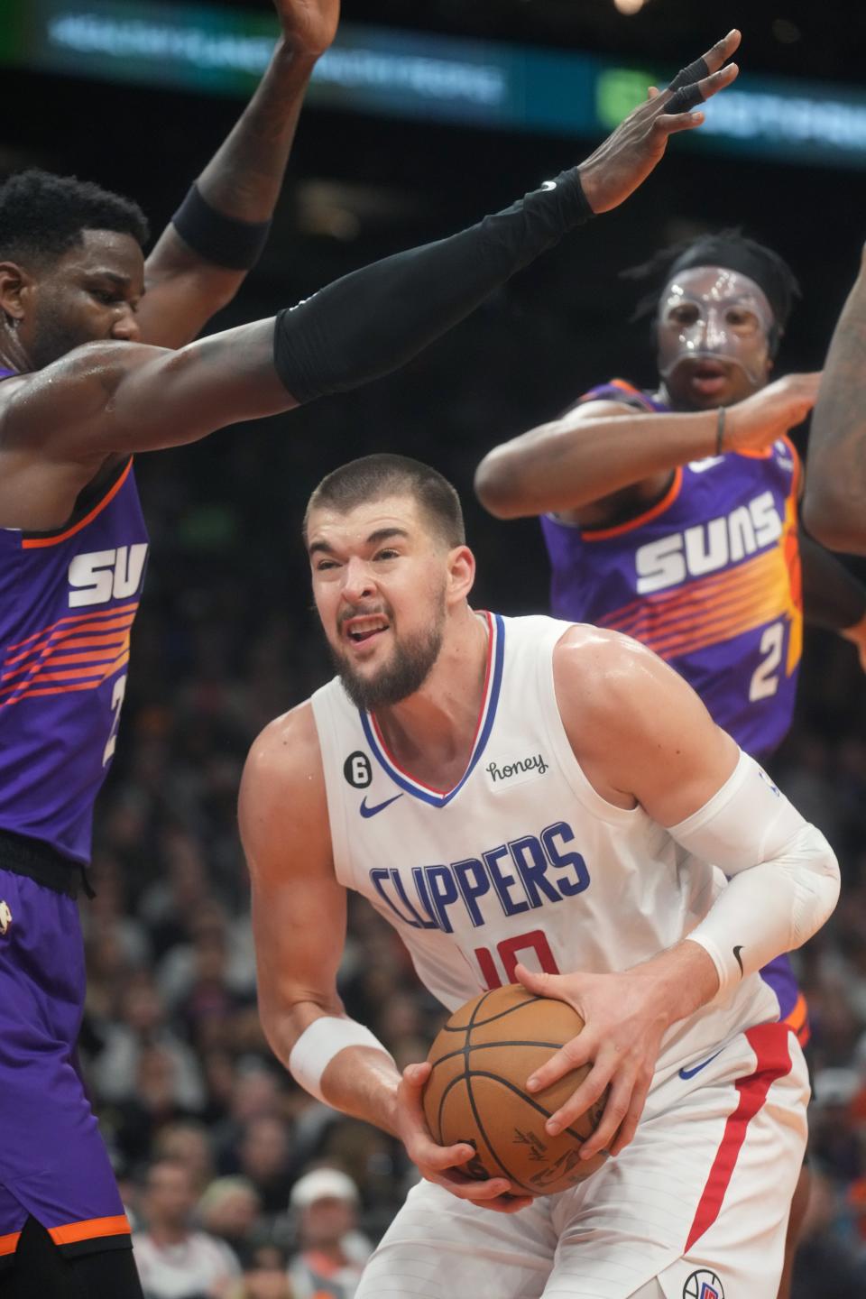 Feb 16, 2023; Phoenix, Arizona, USA; Phoenix Suns center Deandre Ayton (22) defends Los Angeles Clippers center 	Ivica Zubac (40) at Footprint Center. 