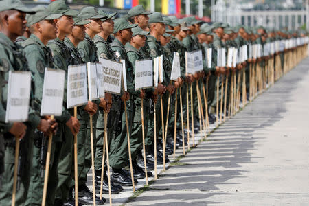 Soldiers stand in formation before the start of a ceremony to kick off the distribution of security forcers and voting materials to be used in the upcoming presidential elections, at Fort Tiuna military base in Caracas, Venezuela May 15, 2018. REUTERS/Carlos Jasso