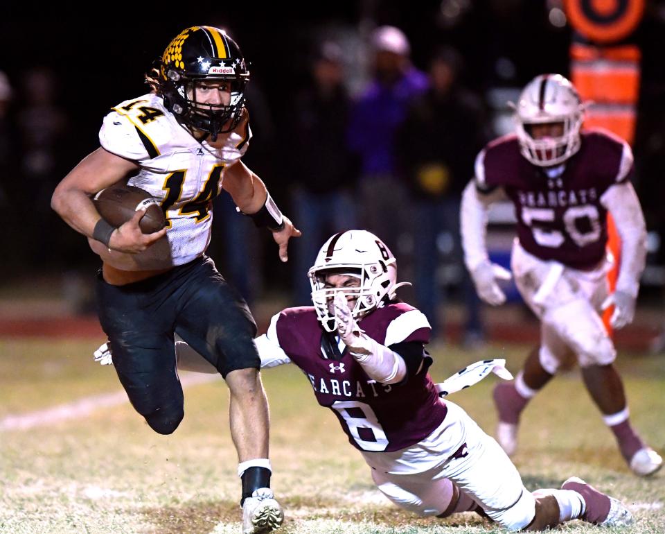 Cisco quarterback Hunter Long outpaces Hawley defensive back Marc Salas during the District 4-2A D I championship game Nov. 4 in Hawley.