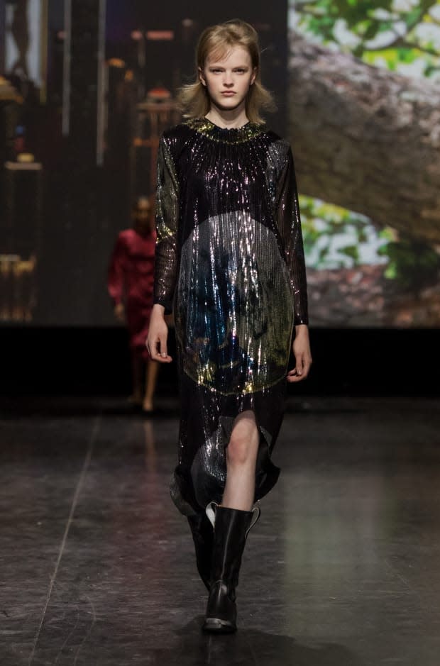 The opening look in Ganni's Fall 2019 collection, featuring a sequined rendering of the globe. Photo: Courtesy of Ganni